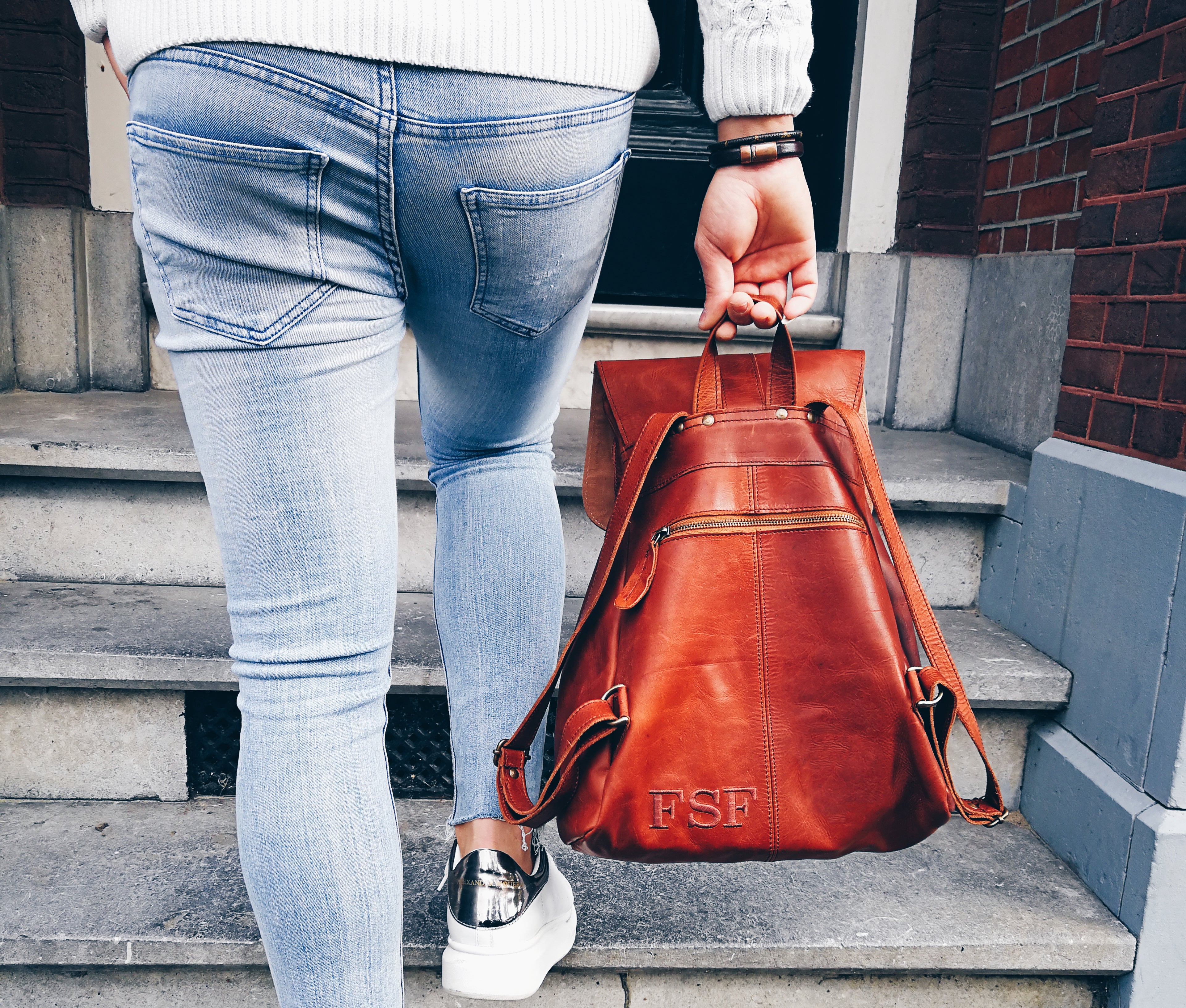 Monogram discount leather backpack